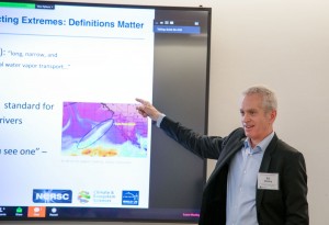 Berkeley Lab climate scientist Bill Collins points at a slide as he speaks.